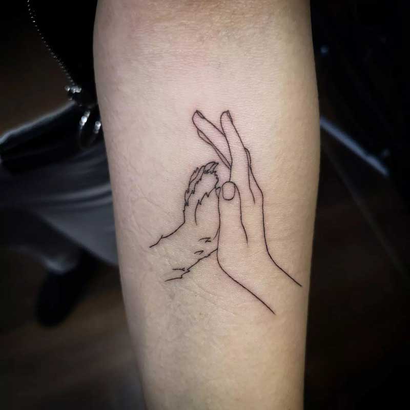 Tattoo uploaded by Devon Barchus  Ink 4 human hand holding dog paw   Tattoodo