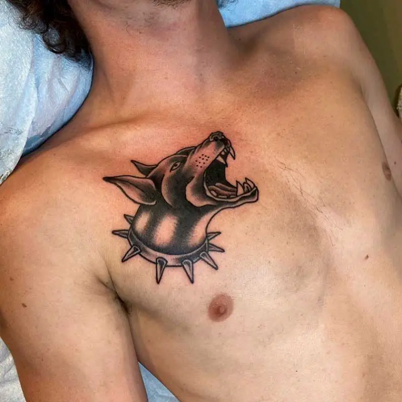 The doberman tattoo a symbol of strength and loyalty 