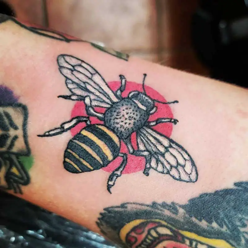 Microrealistic bee tattoo on the inner forearm