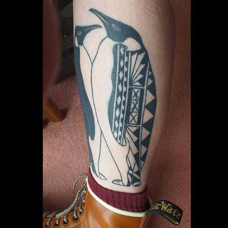 tribal penguin heart tattoo