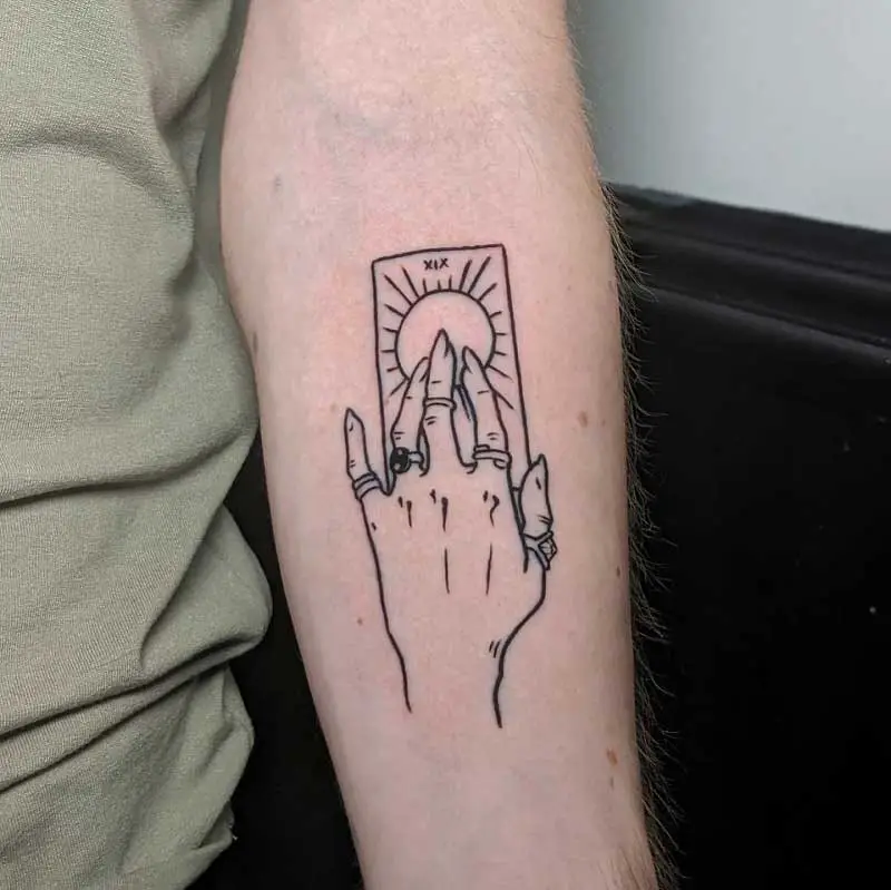 hand-holding-tarot-card-tattoo-2