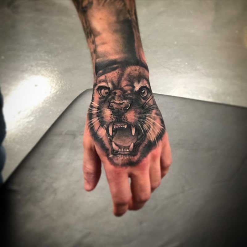 mountain-lion-hand-tattoo-3