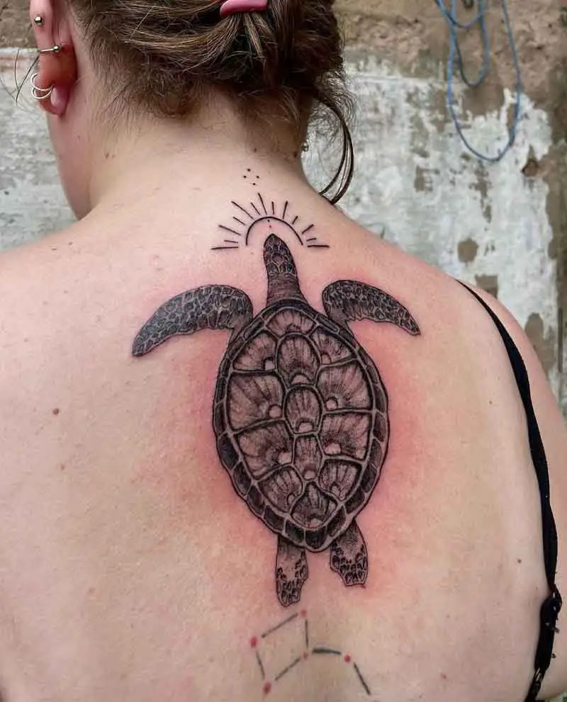 Black Ink Sea Shell Tattoo On Women Upper Back