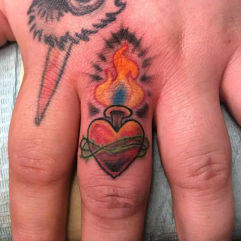sacred-heart-finger-tattoo-2